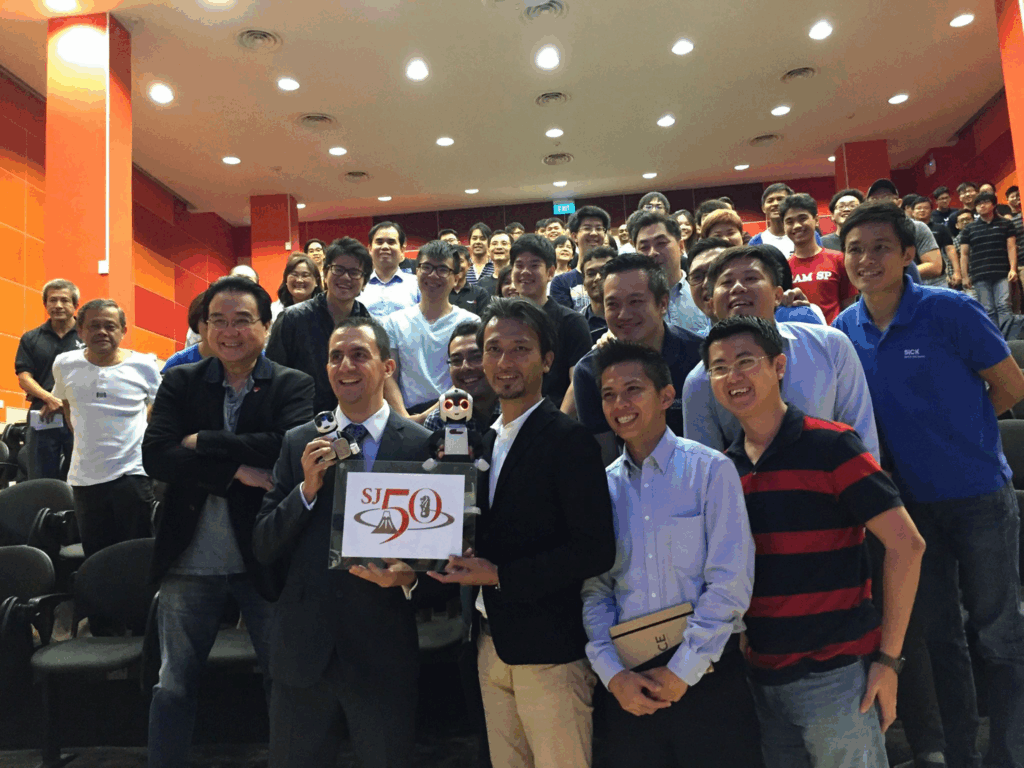 Group picture with Prof Takahashi holding SJ50 logo