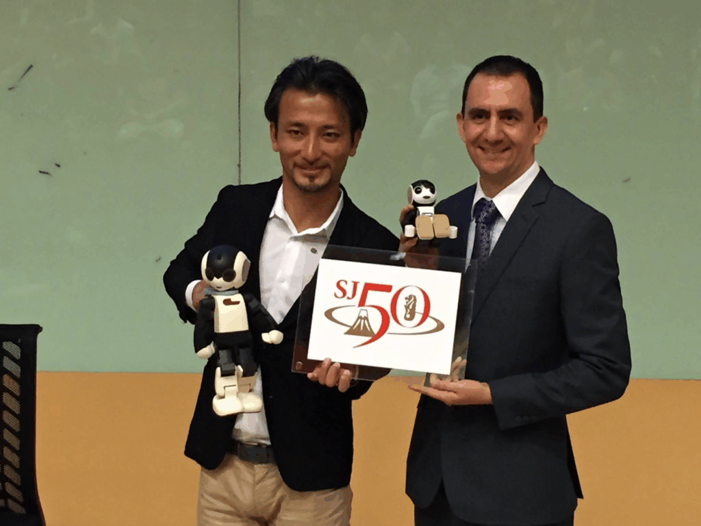 Prof Tomotaka Takahashi from UTokyo in Singapore Polytechnic with SJ50 logo